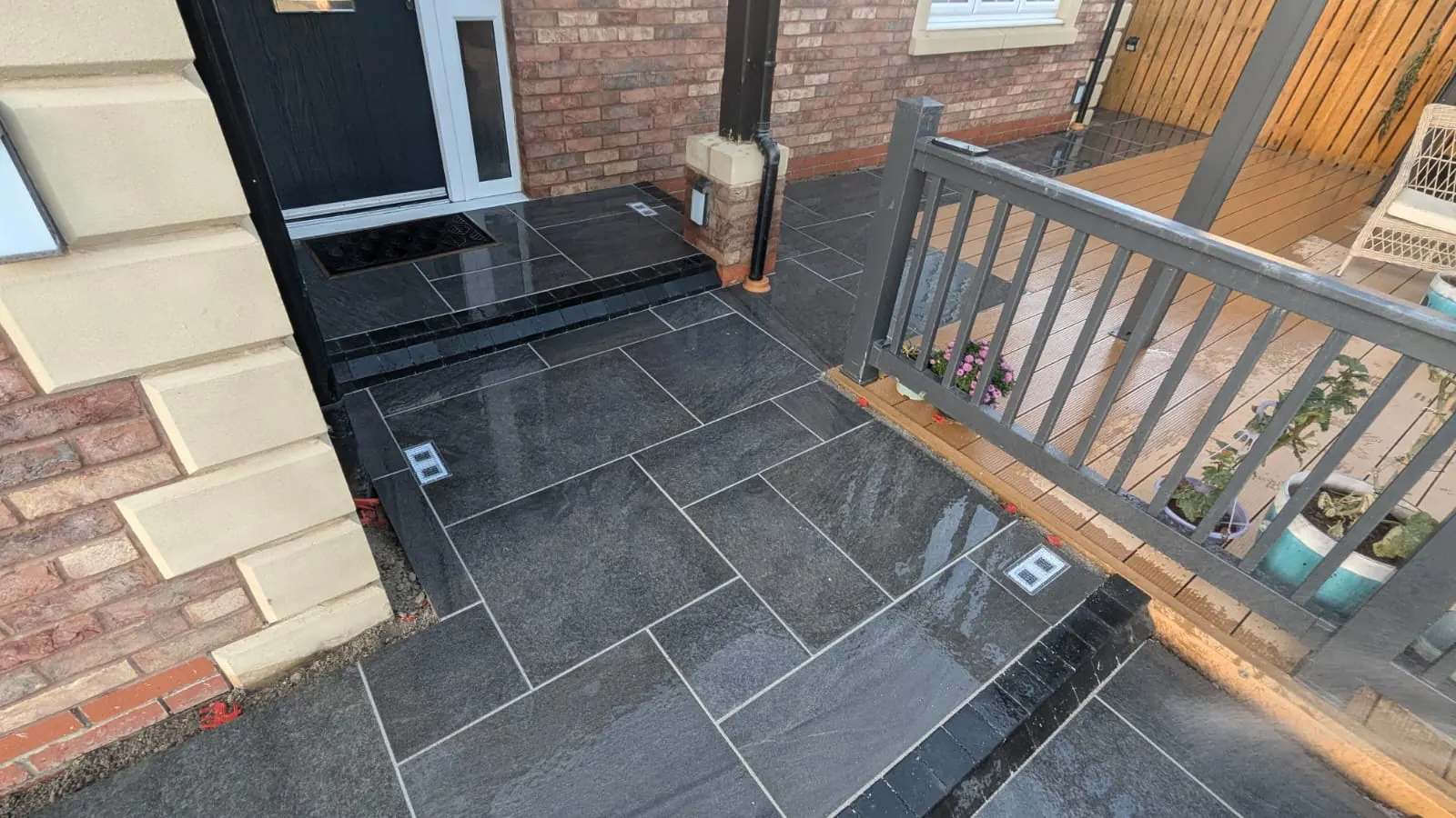 Dark entrance paving with steps and edging