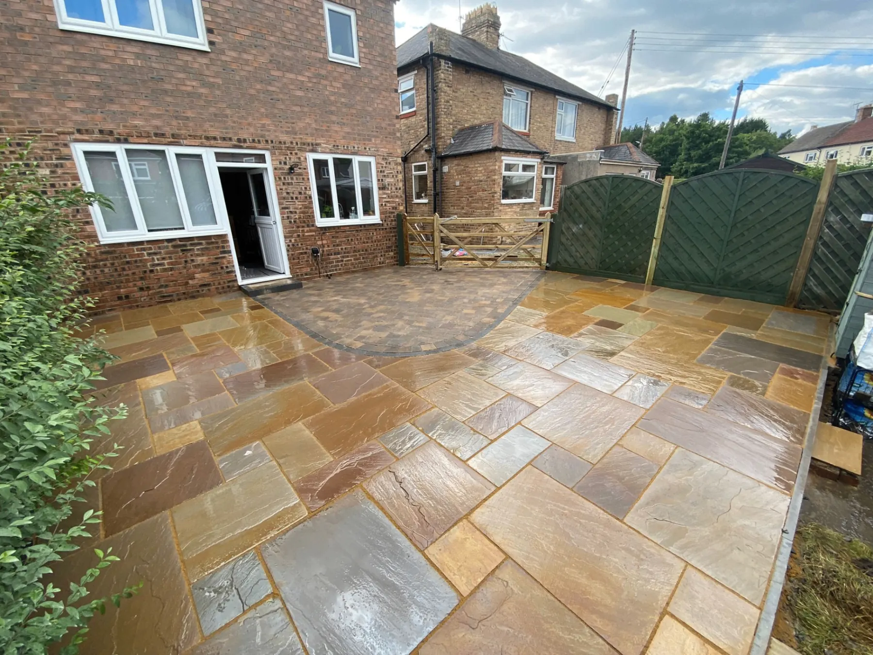 Mixed-tone patio and paved rear garden