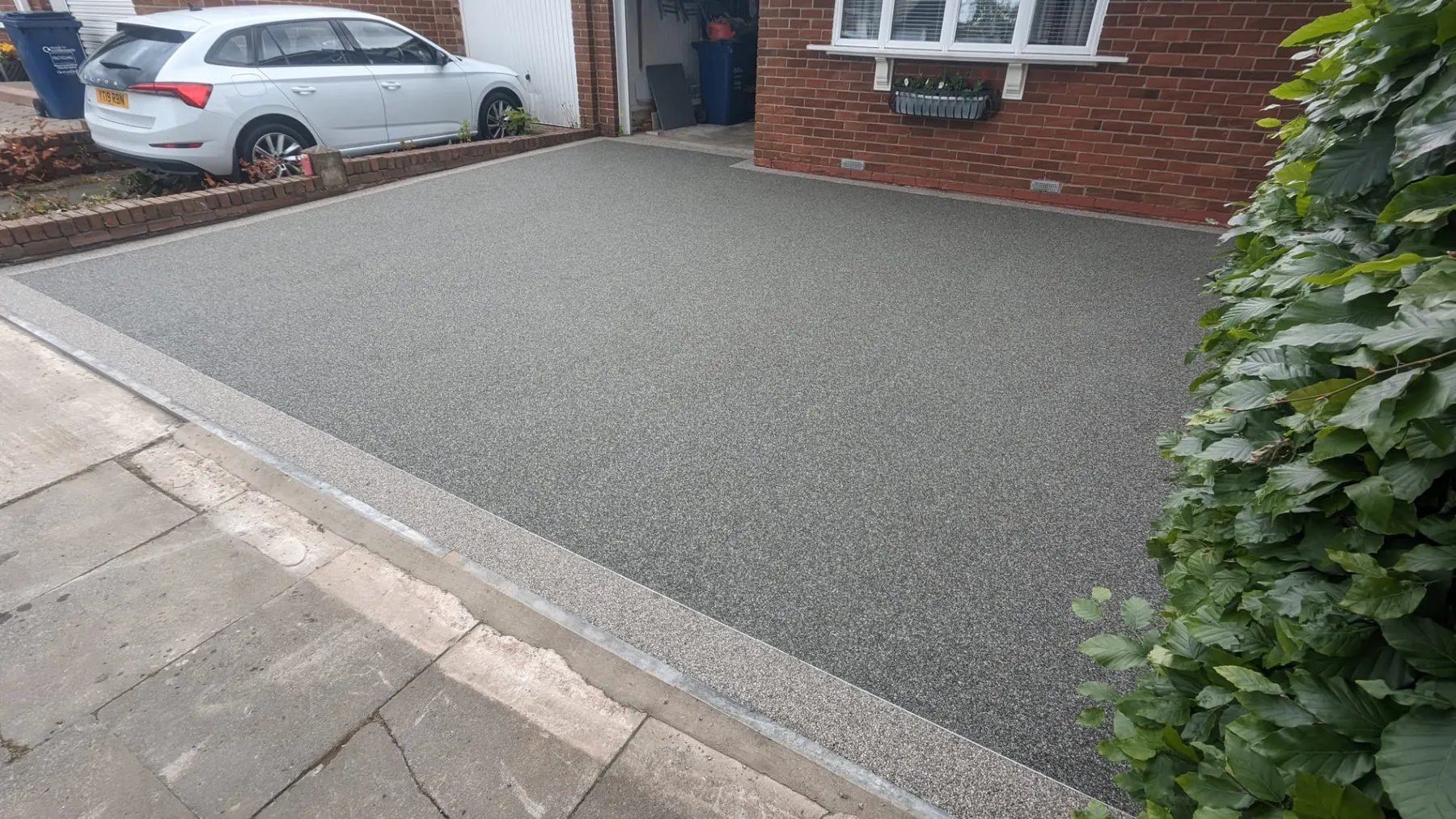 Grey resin bound driveway installation