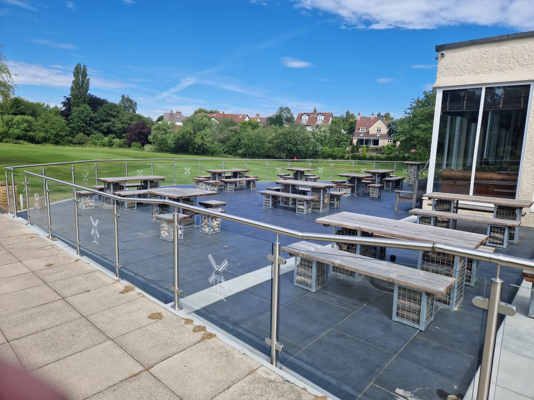 Commercial patio with slate tiling and glass balustrade