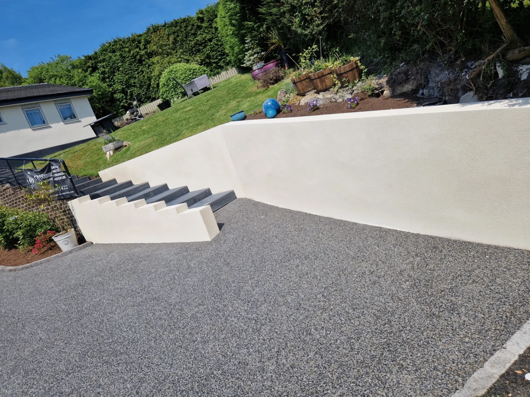 Resin driveway and rendered garden steps