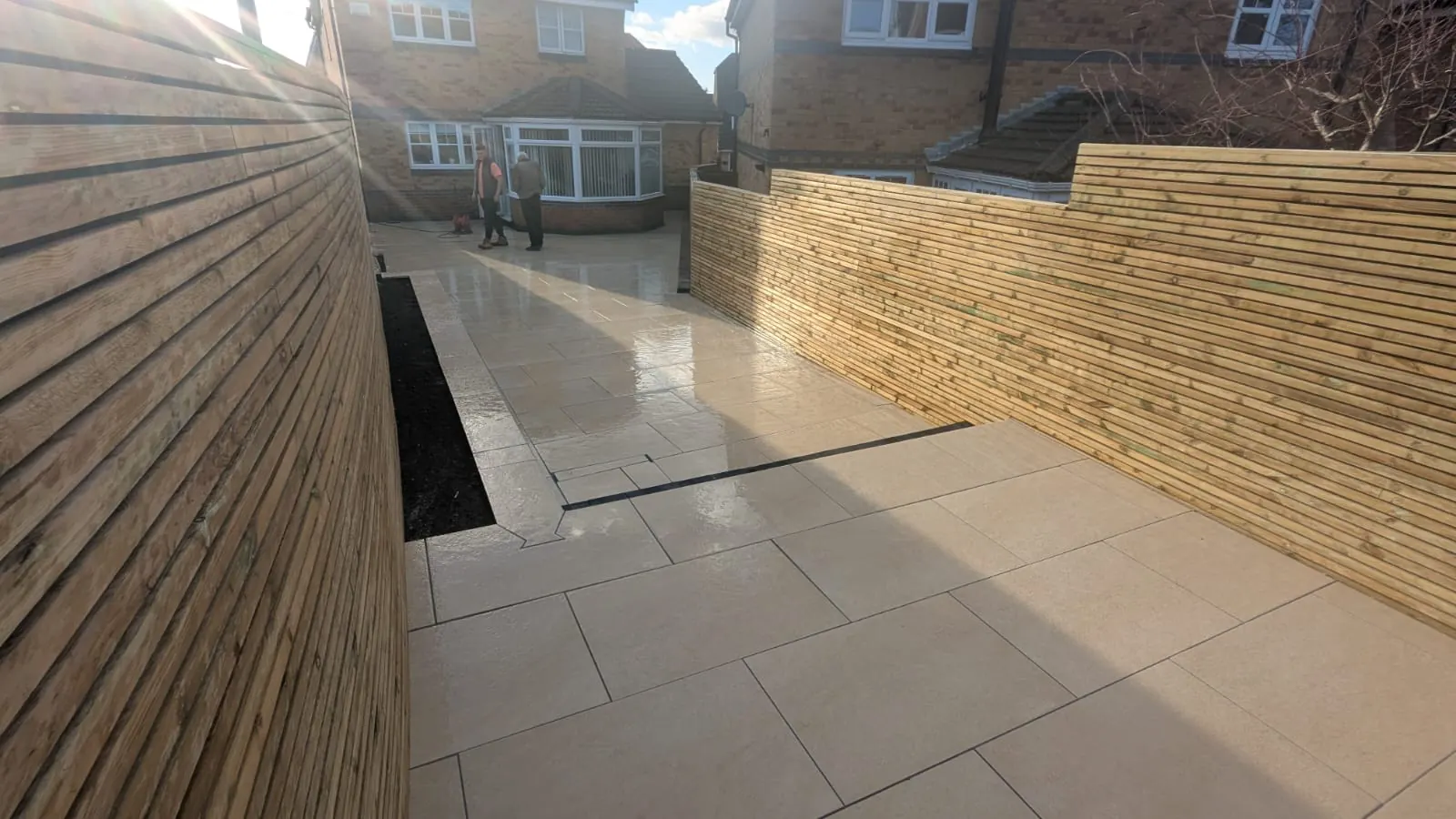Large porcelain patio and side path