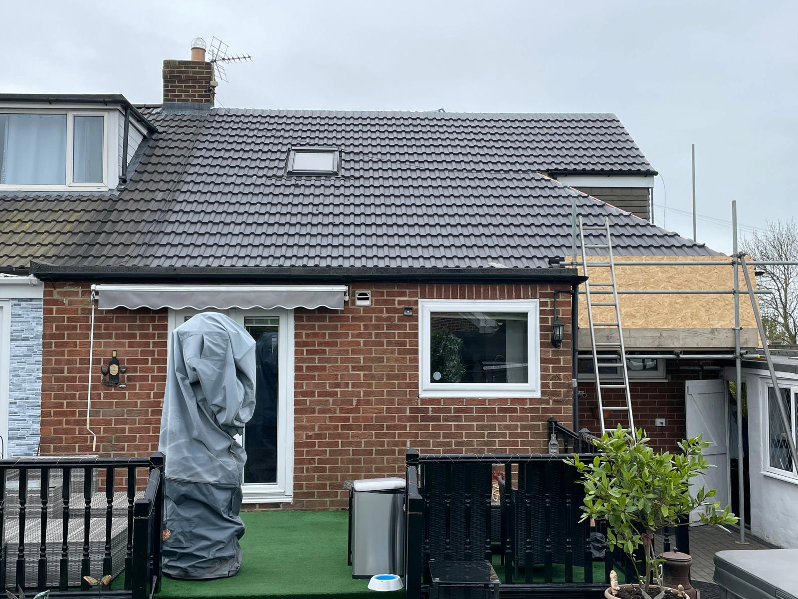 Rear elevation with newly completed tiled roof
