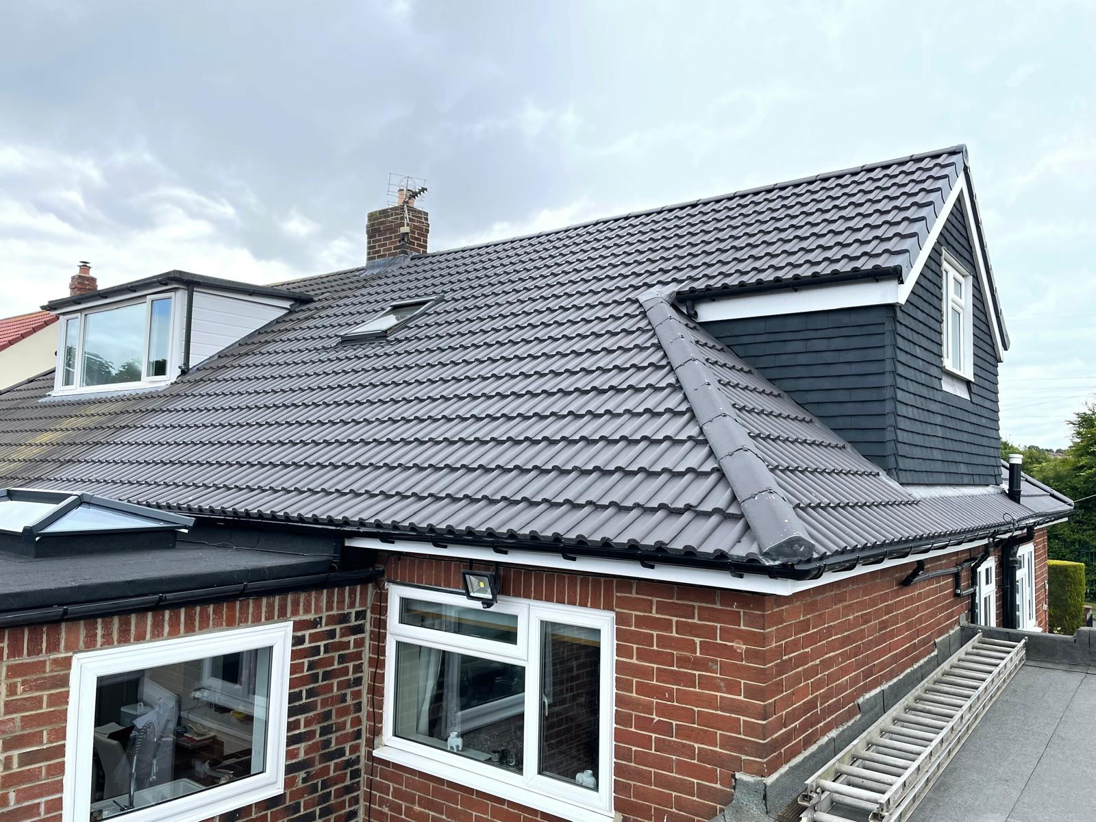 Large rear roof replacement with dormer