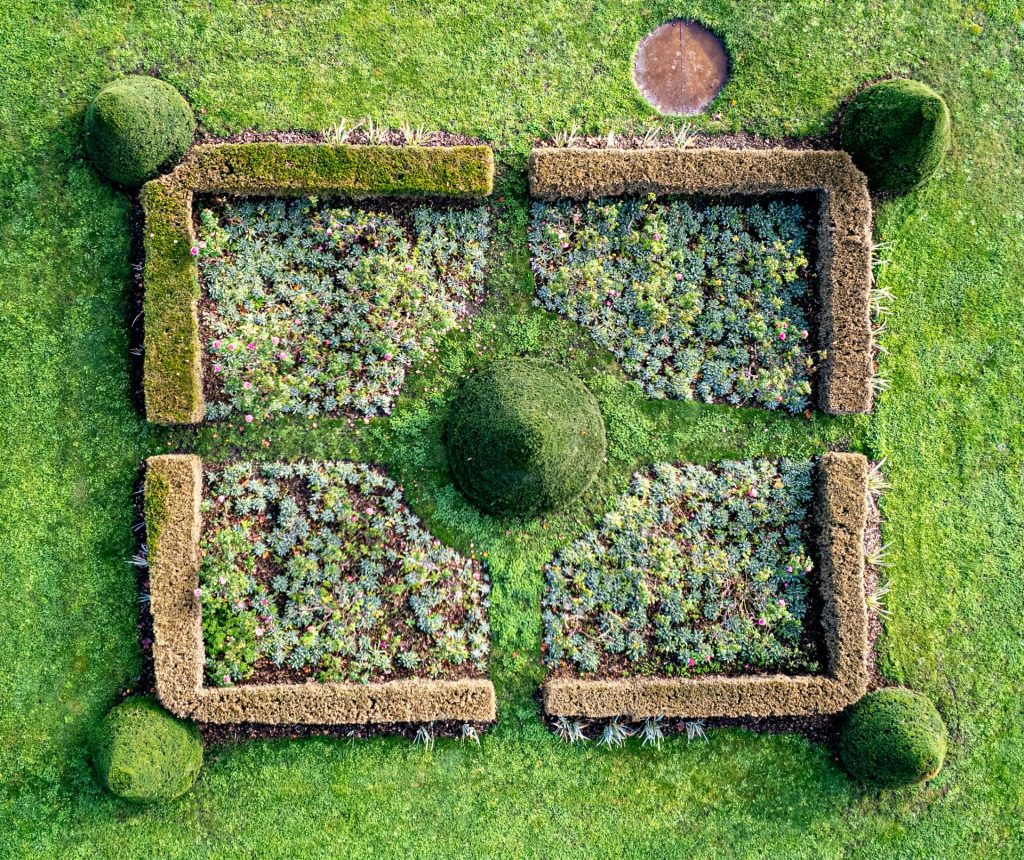 An aerial view of a garden in the grass